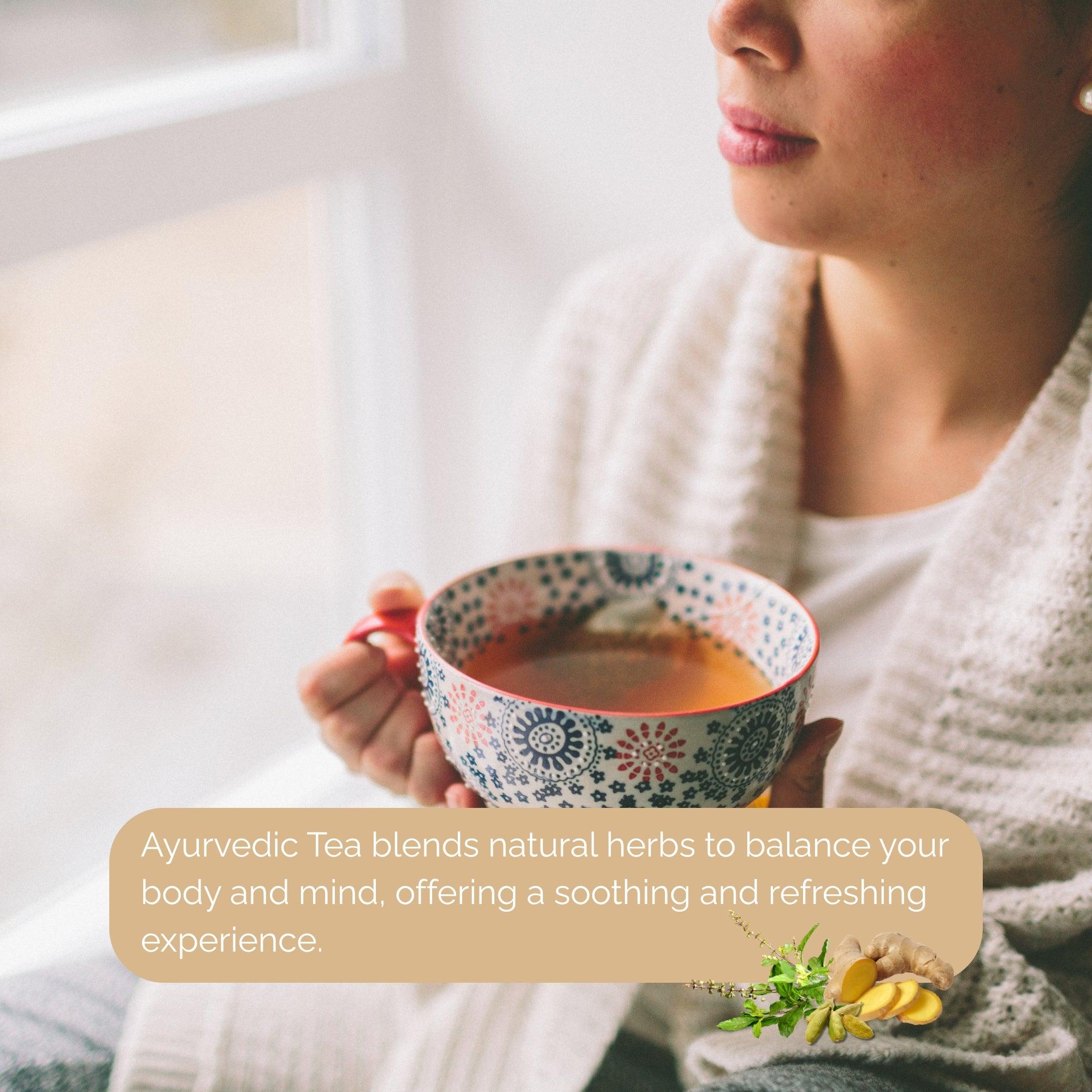 Woman holding a colorful cup of ayurvedic care tea near a window enjoying a soothing herbal drink