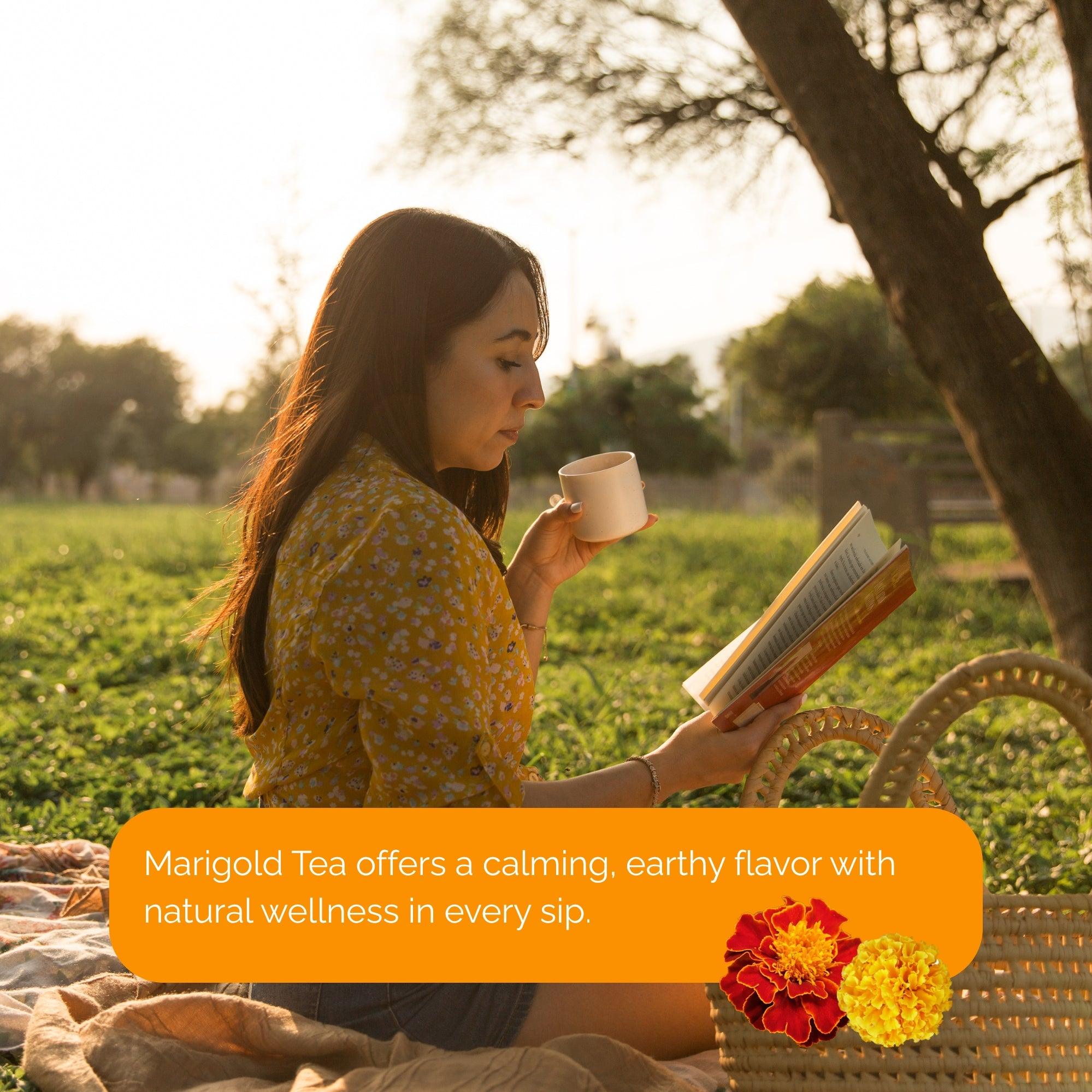 Woman enjoying marigold tea outdoors reading a book in the sun buy marigold tea online