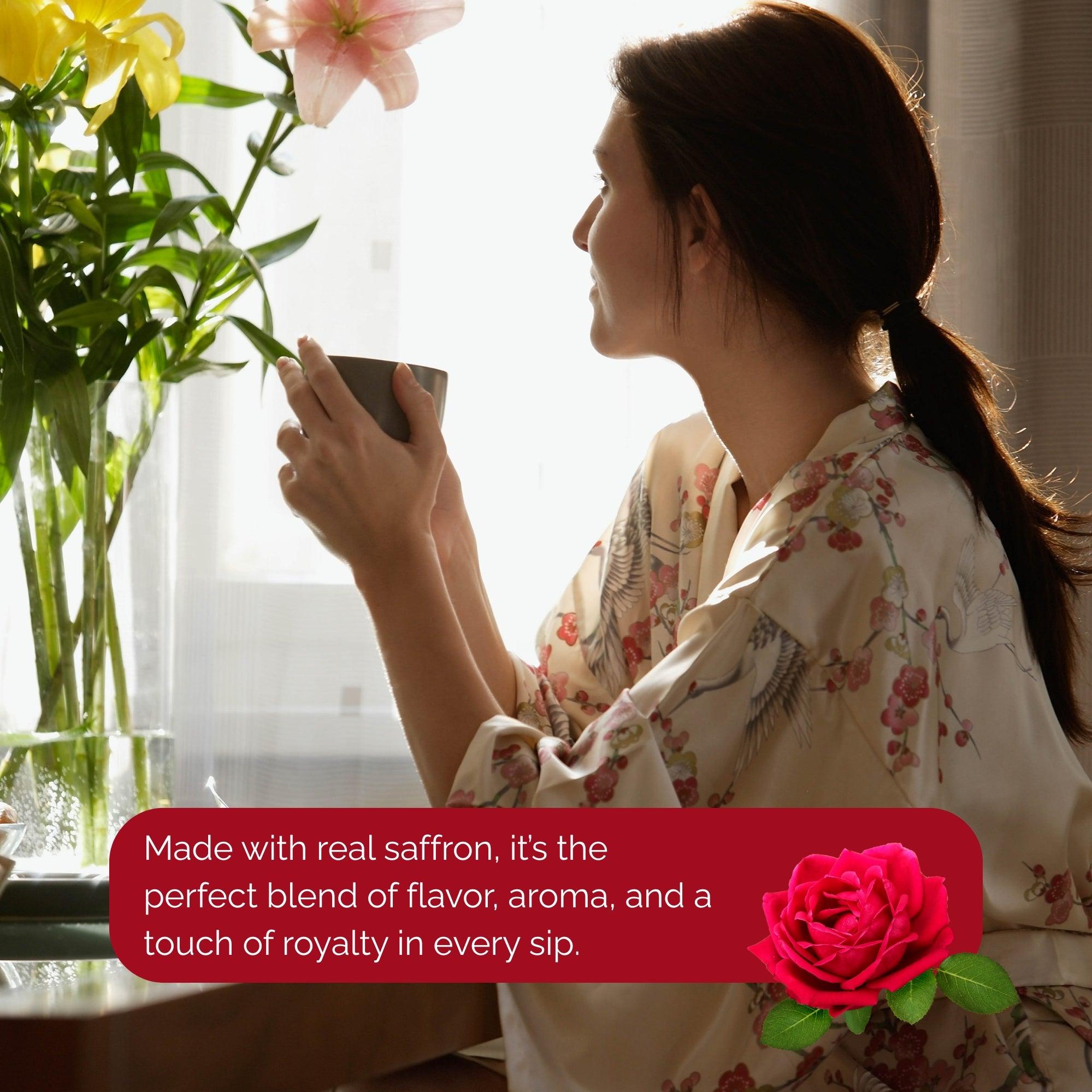 Woman enjoying a cup of tea by the window with flowers nearby to buy premium rose tea online